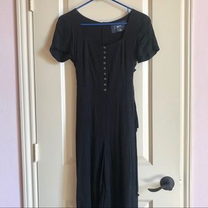 Anthropologie black jumpsuit with lace up sides